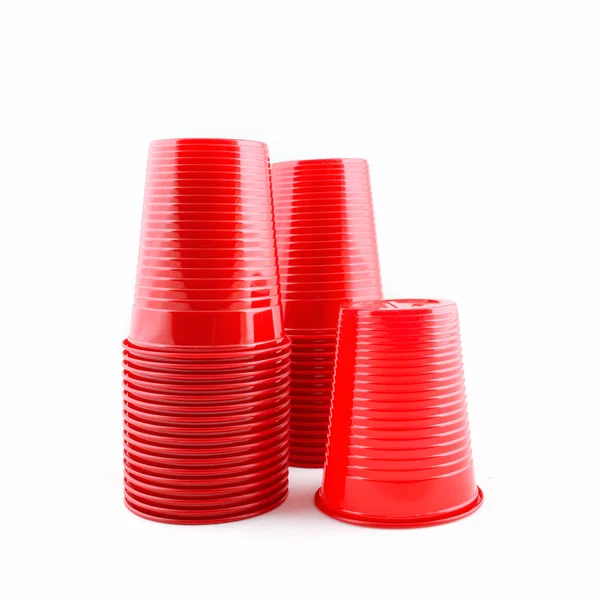 Plastic red cups stack on white background — Stock Photo, Image