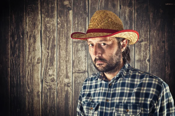 农夫用稻草的牛仔帽 — 图库照片