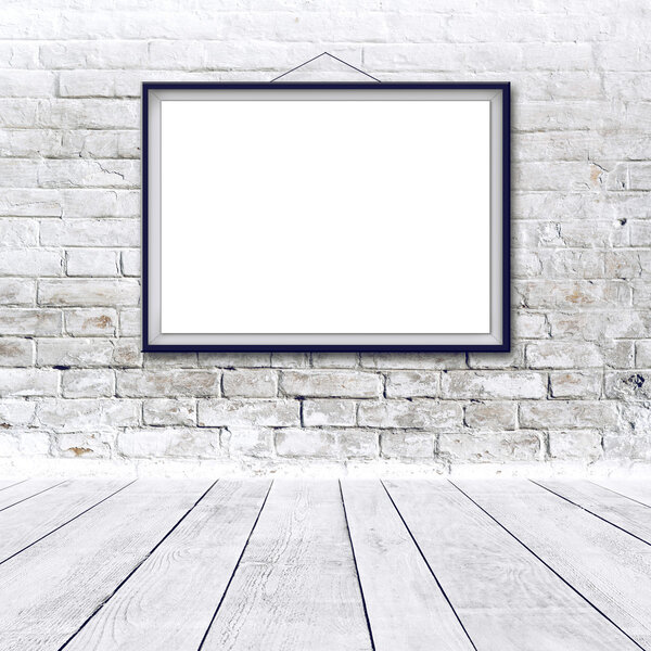 Blank horizontal painting poster in black frame hanging on white brick wall. Painting proportions match international paper size A.
