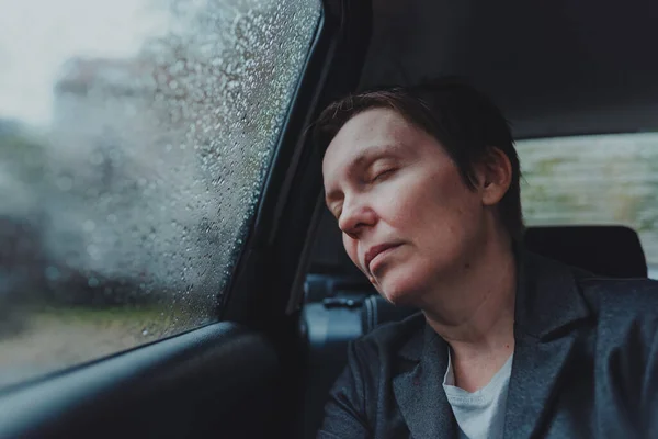 Tired Exhausted Businesswoman Sleeping Backseat Car Rain Selective Focus — Stock Photo, Image