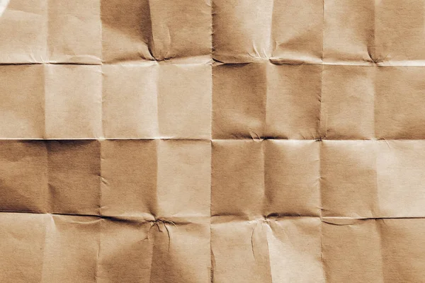 Textuur Van Gevouwen Bruin Papier Als Achtergrond Bovenaanzicht — Stockfoto