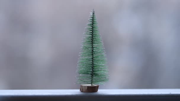 Mini Tabletop Christmas Fir Tree Snowing Flakes Bokeh Background Selective — Video Stock