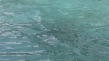 Slow motion footage of pool water surface, tranquil and peaceful background