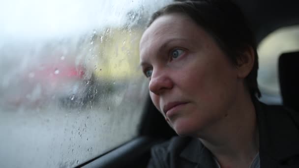 Disappointed Worried Businesswoman Looking Out Window Taxi Vehicle Cold Rainy — Stock Video