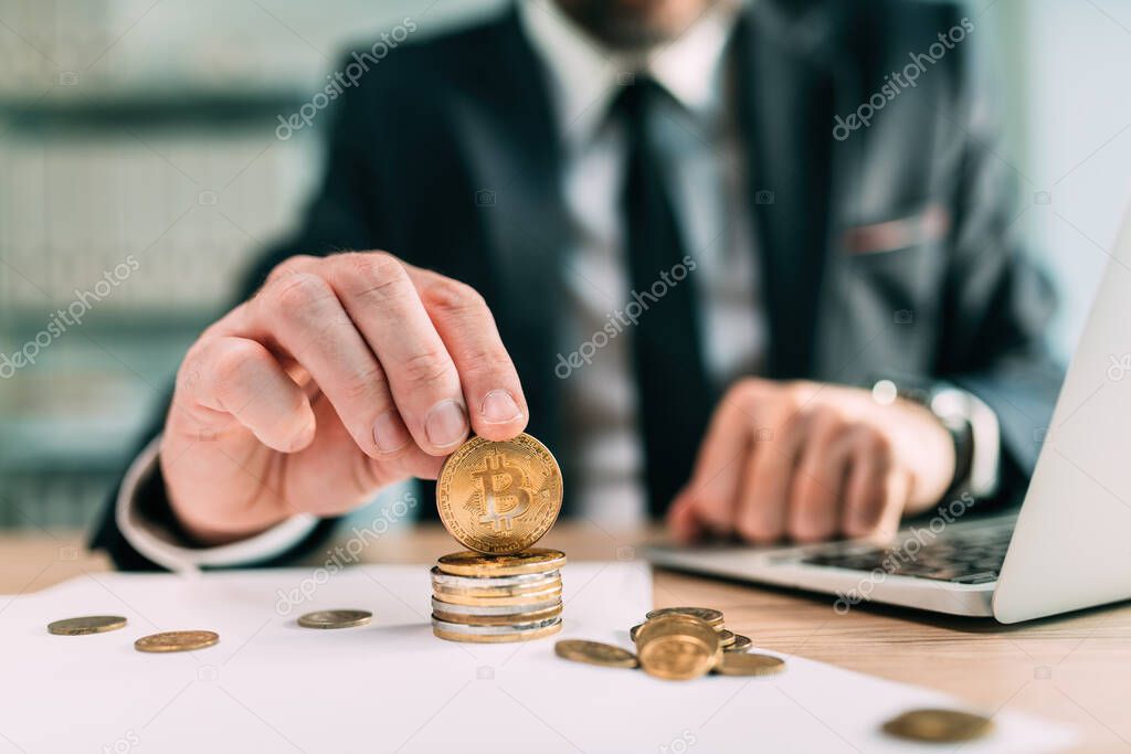 Bitcoin brokerage concept, businessman with cryptocurrency coins, selective focus