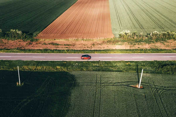 Driving Red Car Black Roof Highway Countryside Landscape Sunny Springtime —  Fotos de Stock