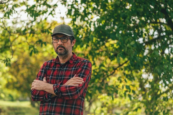 Portrait Male Farmer Arms Crossed Wearing Plaid Shirt Trucker Hat — Zdjęcie stockowe