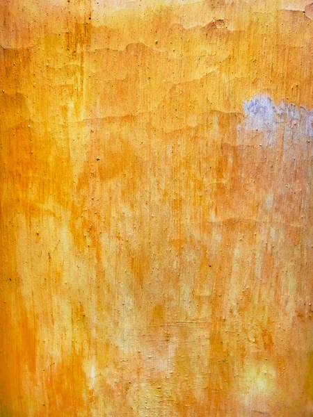 粗粒地としてオレンジ色に塗られた古い壁の表面 — ストック写真
