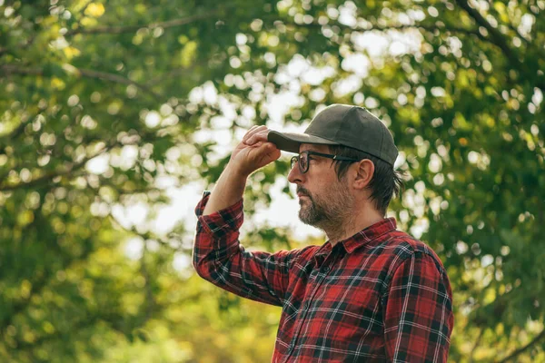 Portrait Male Farmer Wearing Plaid Shirt Trucker Hat Walnut Fruit — Stockfoto