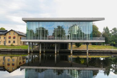 Halmstad, Sweden - August 18, 2022: Halmstads Stadsbibliotek, modern modern city library the east bank of the river between Kapsylparen and Filtparken.