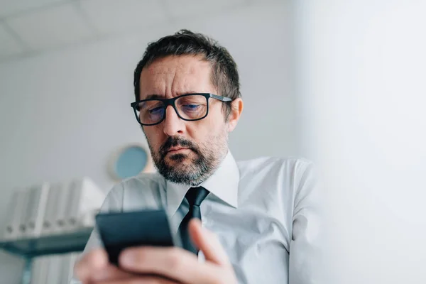 Businessman Reading Worrisome Text Message Mobile Phone Selective Focus — Stock Photo, Image