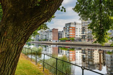 Halmstad, Sweden - August 18, 2022: Halmstad Solsida, residential area on Nissan riverbank in this beautiful Swedish city. Solsida means Sunny side.