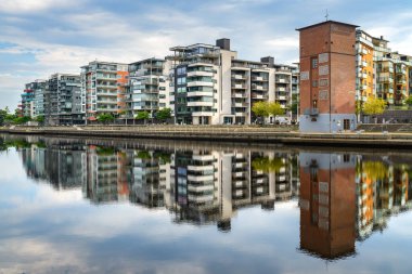 Halmstad, Sweden - August 18, 2022: Halmstad Solsida, residential area on Nissan riverbank in this beautiful Swedish city. Solsida means Sunny side.