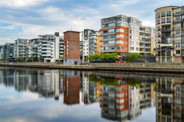 Halmstad, Sweden - August 18, 2022: Halmstad Solsida, residential area on Nissan riverbank in this beautiful Swedish city. Solsida means Sunny side.