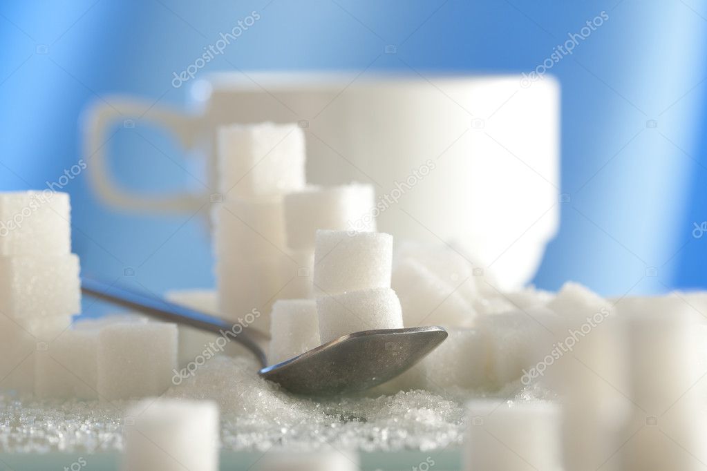 Spoonful of sugar cubes with shallow depth of field