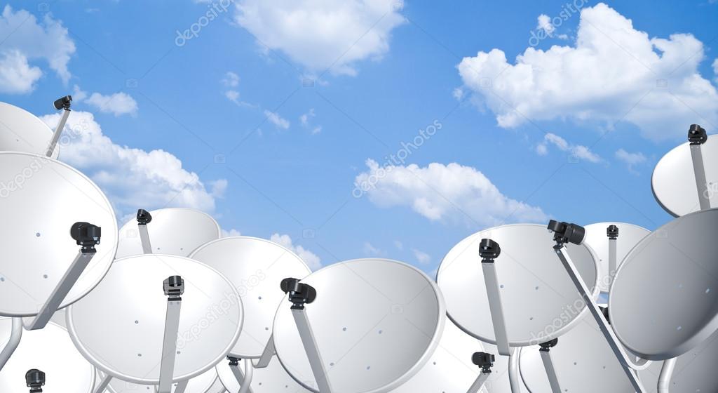 Satellite dish space technology receiver over blue sky