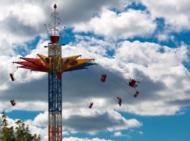 Chairoplane in sky clipart