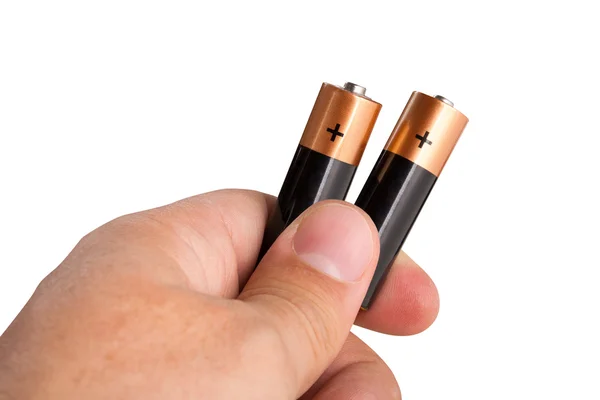 Hand holding two batteries — Stock Photo, Image