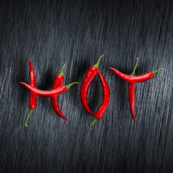 Hot message made of chili peppers — Stock Photo, Image