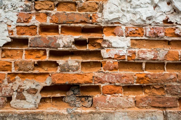 Parede de tijolo quebrado — Fotografia de Stock