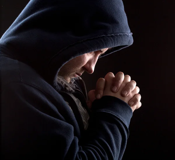 Praying bandit — Stock Photo, Image