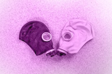 Loving couple of gas masks clipart
