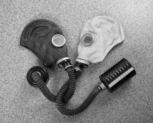 Loving couple of gas masks