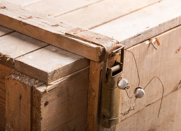 Latch with seal on wooden chest — Stock Photo, Image