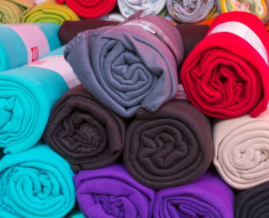 Rolled colorful fleece blankets clipart