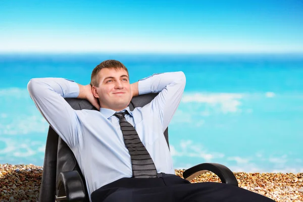 Businessman dreaming about vacation — Stock Photo, Image
