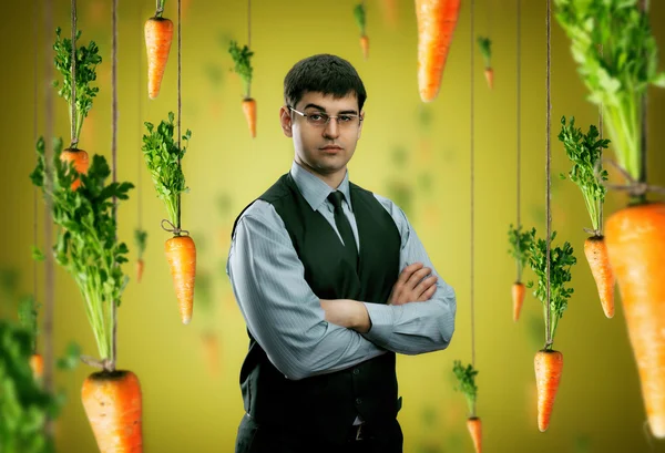 Businessman and carrots — Stock Photo, Image