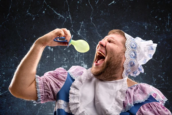 Crazy man sucking a pacifier — Stock Photo, Image