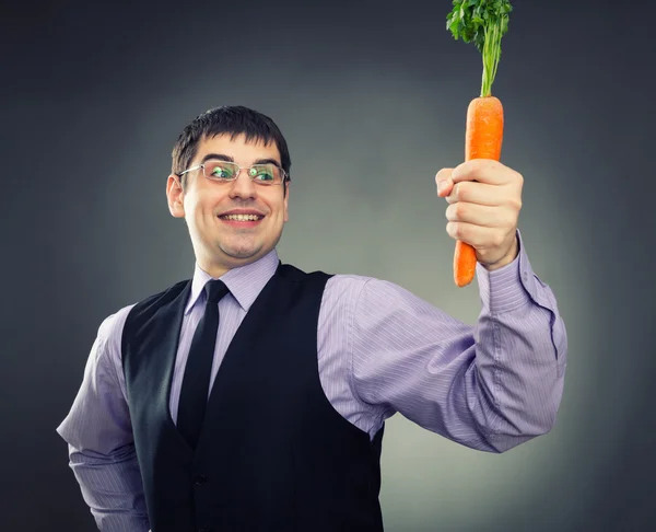 Carrot in hand — Stock Photo, Image