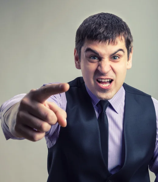 Angry businessman pointing — Stock Photo, Image