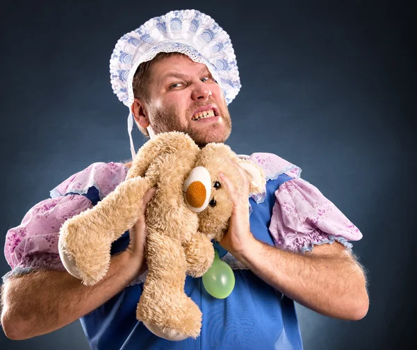 Spiteful man with teddy bear — Stock Photo, Image