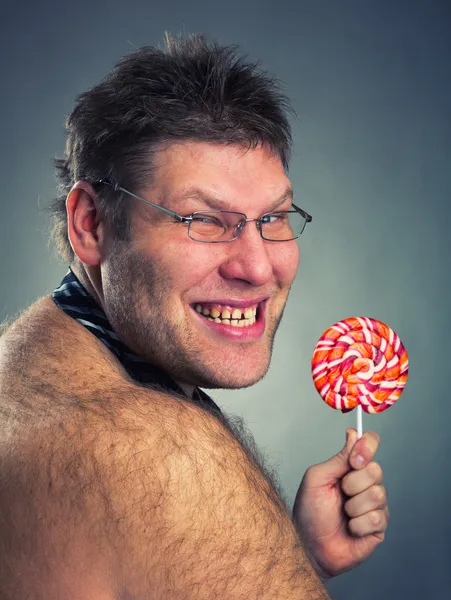Angry man with lollypop — Stock Photo, Image