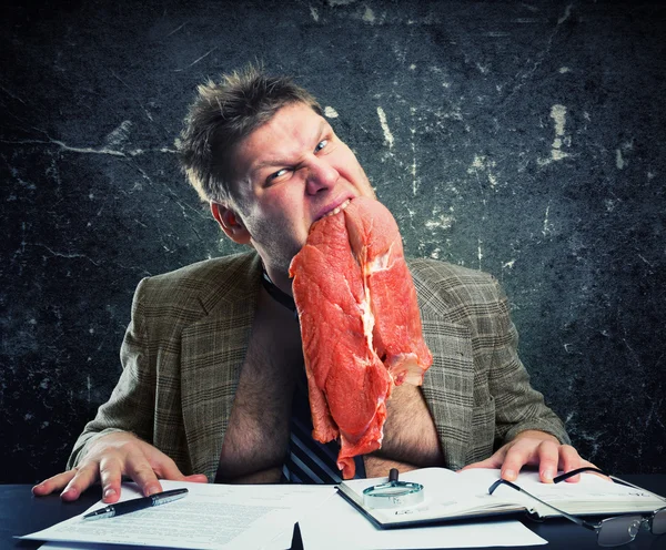 Crazy businessman with meat — Stock Photo, Image