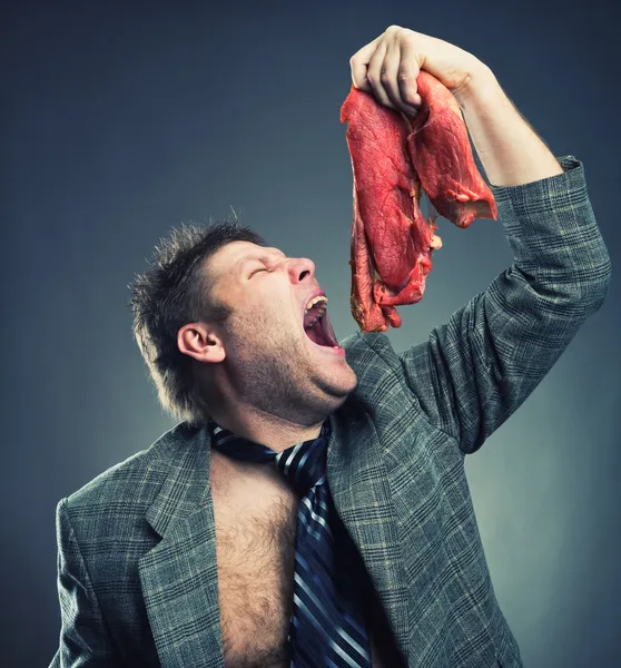 Crazy businessman with meat — Stock Photo, Image