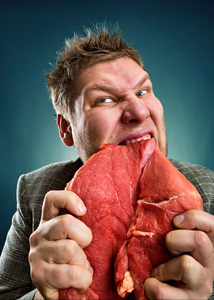 Crazy businessman with meat — Stock Photo, Image