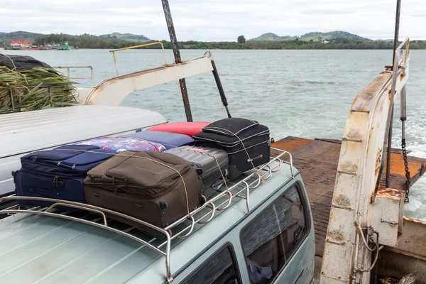 Suitcases over river landscape — Stock Photo, Image