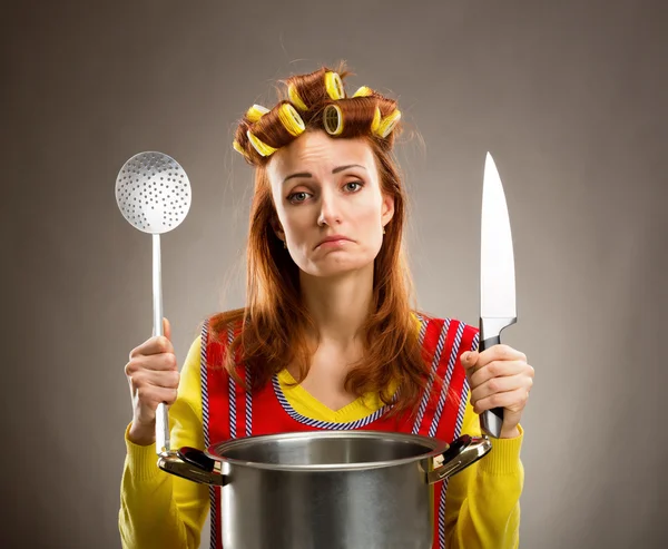 Sad housewife with sause pan — Stock Photo, Image