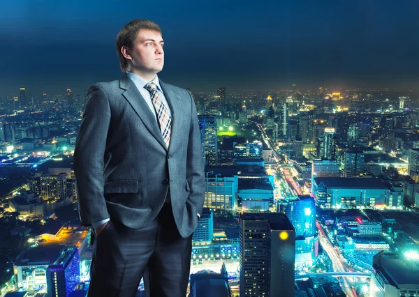 Businessman staying infront of city view — Stock Photo, Image