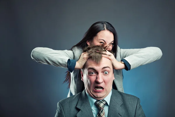 Woman makes pressure on man's head — Stock Photo, Image