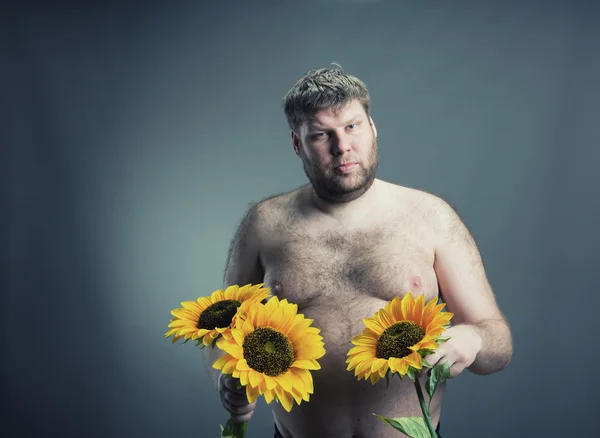 Portrait of man with bouquet  sunflowers — Stock Photo, Image