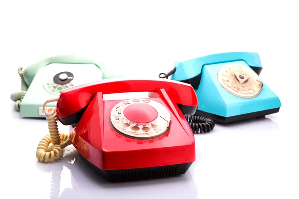 Red telephones on white — Stock Photo, Image