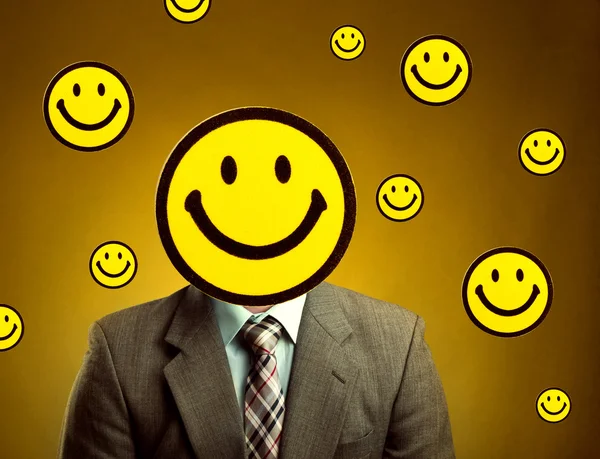 Businessman with smiley face instead of head — Stock Photo, Image
