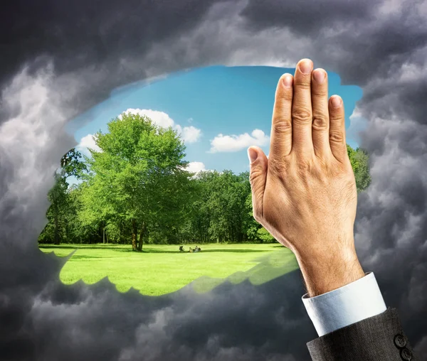 Hand cleaning window with blue sky — Stock Photo, Image