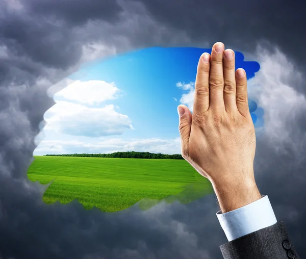 Hand cleaning window with blue sky — Stock Photo, Image