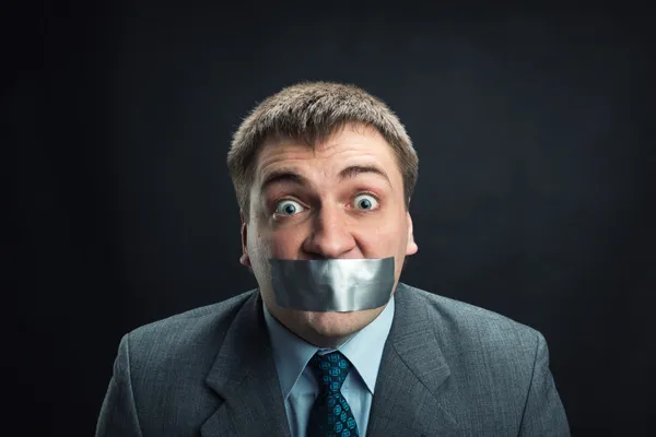 Hombre con boca cubierta por cinta adhesiva —  Fotos de Stock