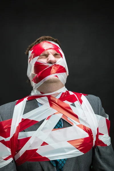 Man with stripped duct tape over body — Stock Photo, Image